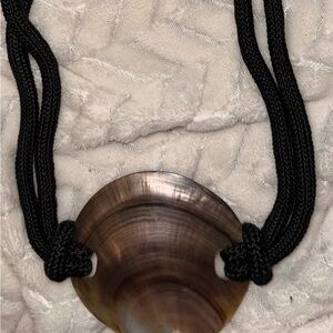 Black Cord Shell Belt Women’s Natural Accent has gold colored closure